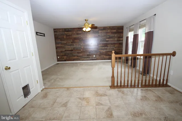 a view of staircase with white walls