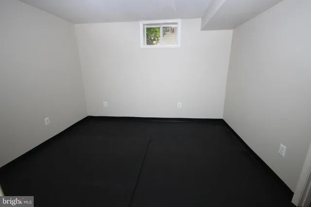 an empty room with wooden floor