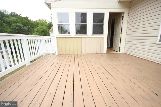 a balcony with wooden floor