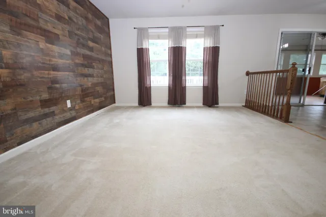 a view of an empty room with windows