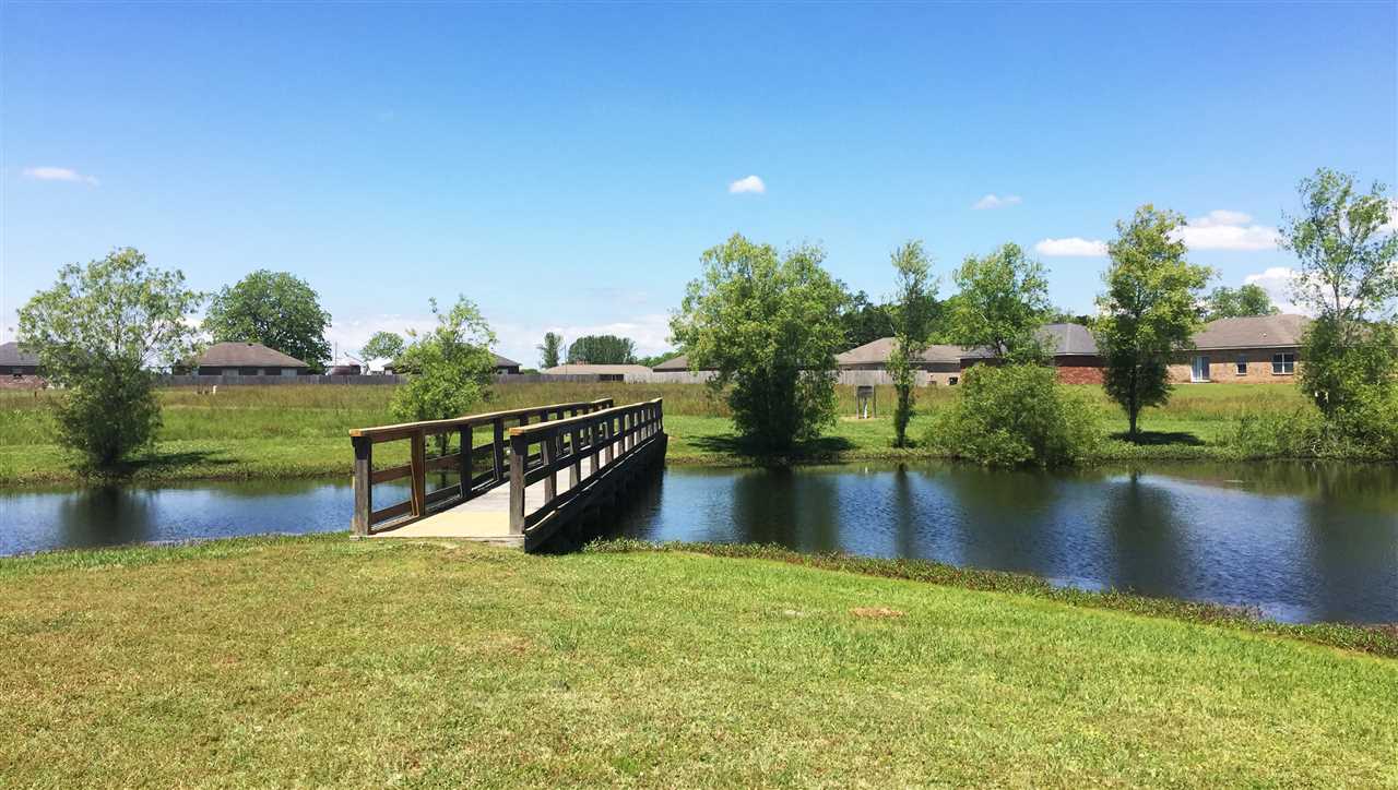 13569 Charmont Way Loxley, AL 36551 - Photo 21 of 26 LAKE AND WALKWAY TO GAZEB