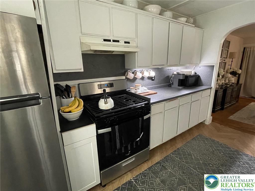 201 Spring Street Easton, PA 18042 - Photo 12 of 27 White cabinetry provides ample storage in this well-appointed kitchen