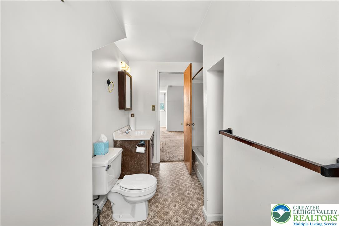 168 Springhouse Road Allentown, PA 18104 - Photo 32 of 49 Functional bathroom with a classic toilet and vanity, offering essential amenities for daily routines.