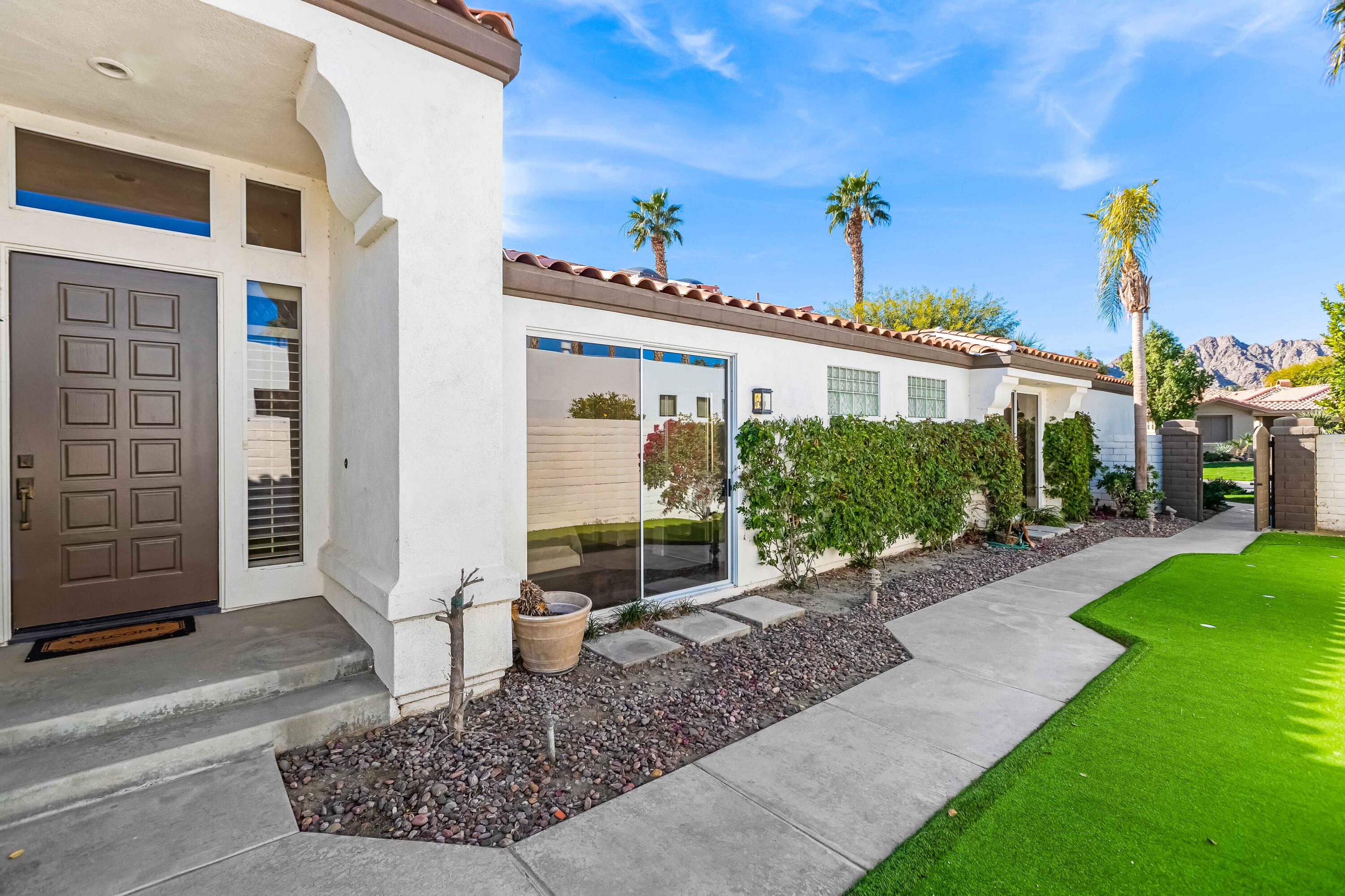 57600 Interlachen La Quinta, CA 92253 - Photo 16 of 87 a view of a house with backyard and garden