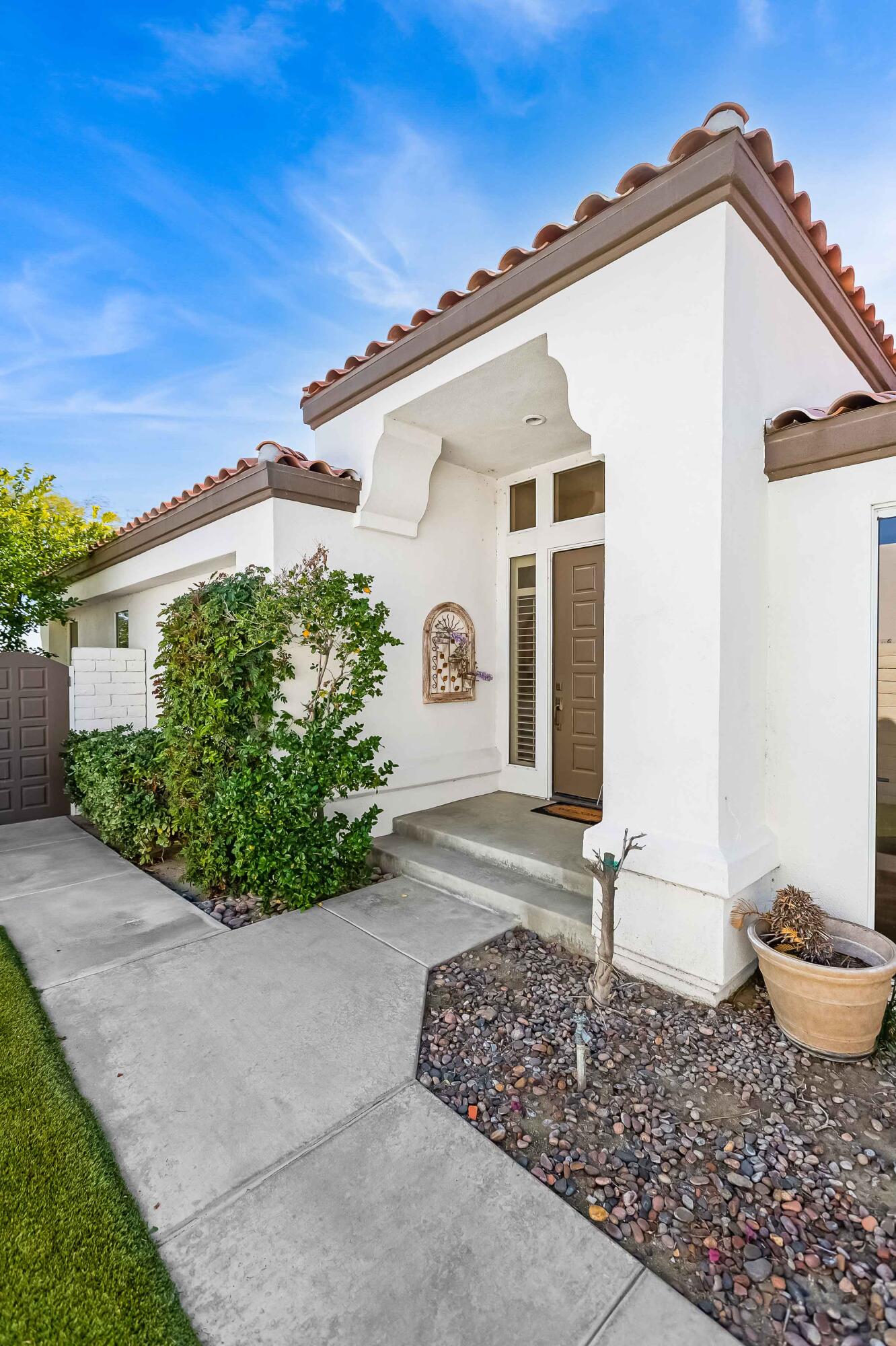 57600 Interlachen La Quinta, CA 92253 - Photo 17 of 87 a front view of a house with garden