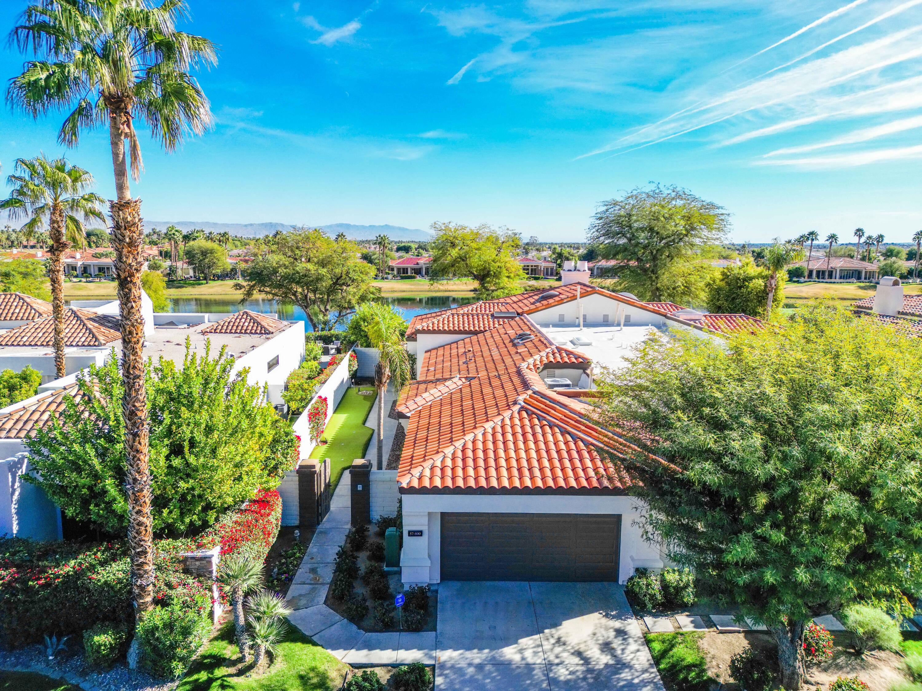 57600 Interlachen La Quinta, CA 92253 - Photo 3 of 87 a view of a swimming pool with a patio and a yard