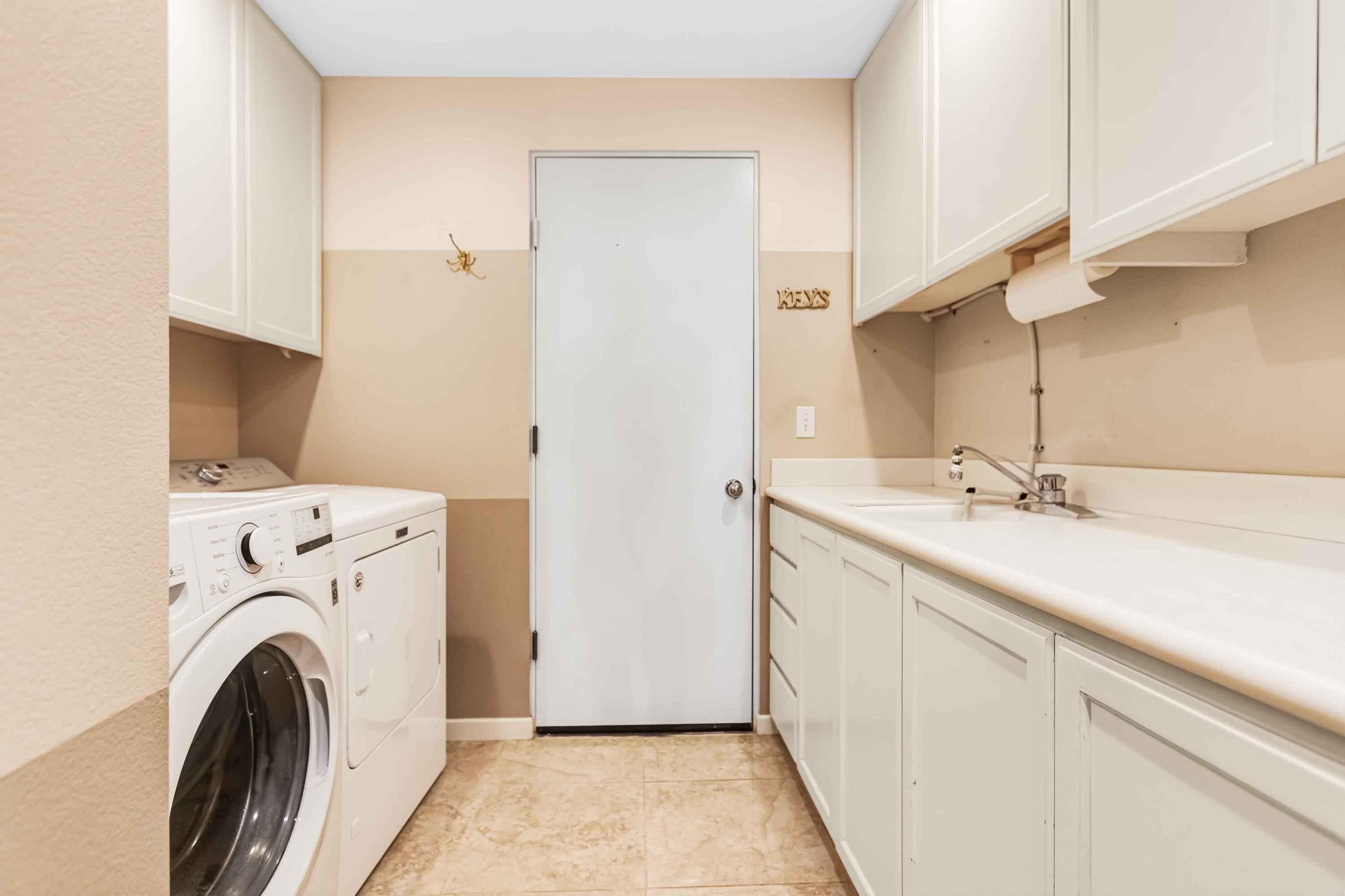 57600 Interlachen La Quinta, CA 92253 - Photo 36 of 87 a view of a kitchen with sink washer and dryer