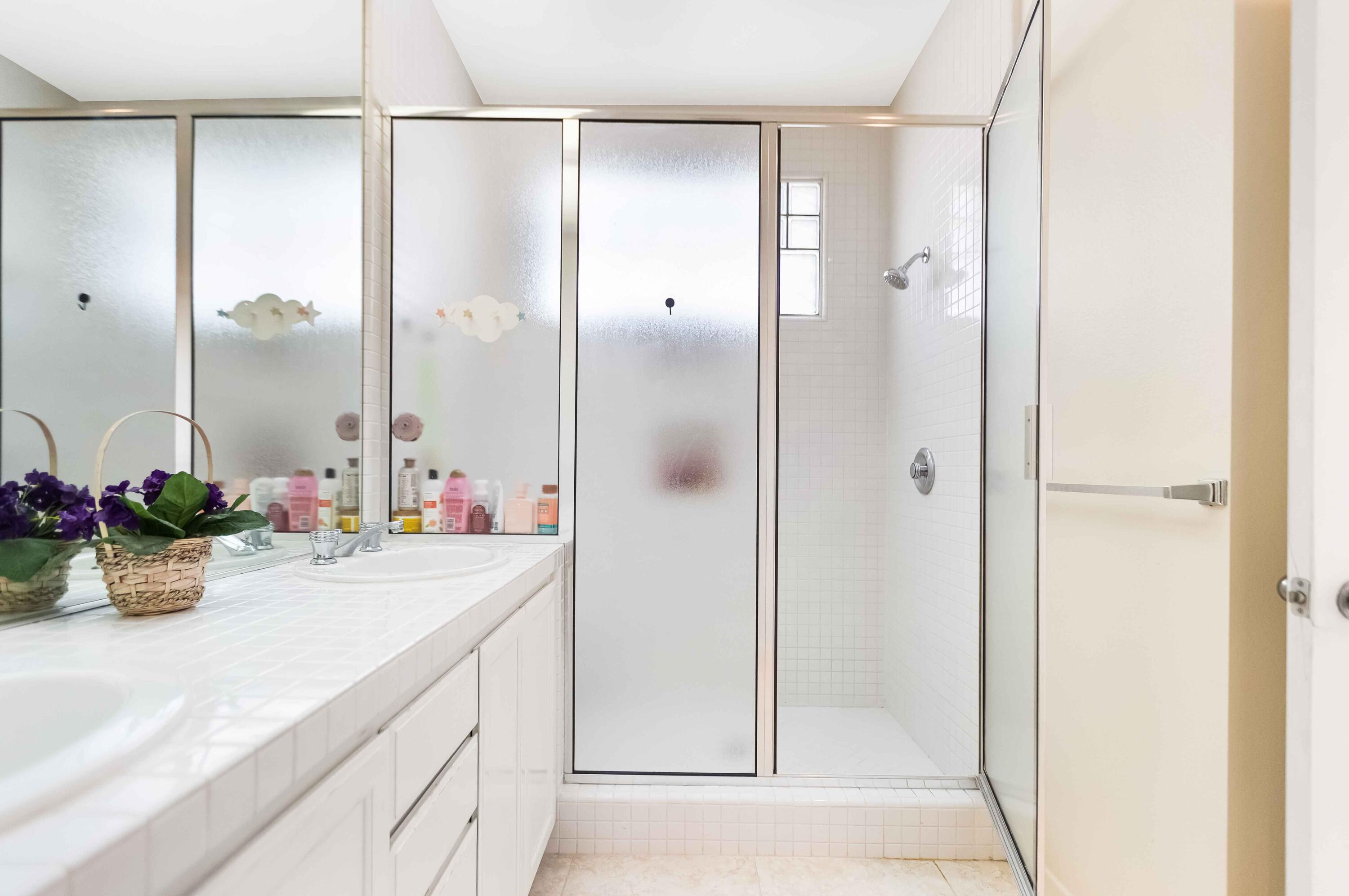 57600 Interlachen La Quinta, CA 92253 - Photo 42 of 87 a bathroom with a double vanity sink mirror and shower