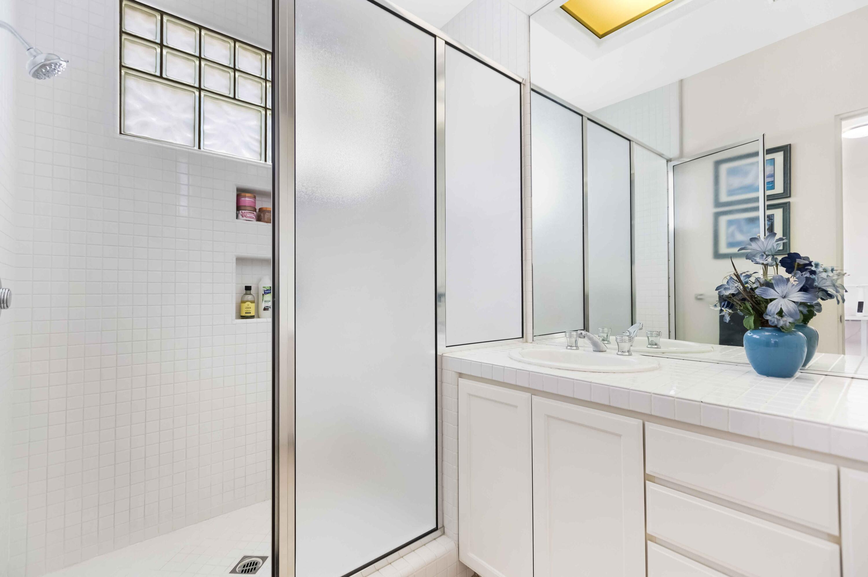 57600 Interlachen La Quinta, CA 92253 - Photo 43 of 87 a bathroom with a granite countertop sink and a mirror