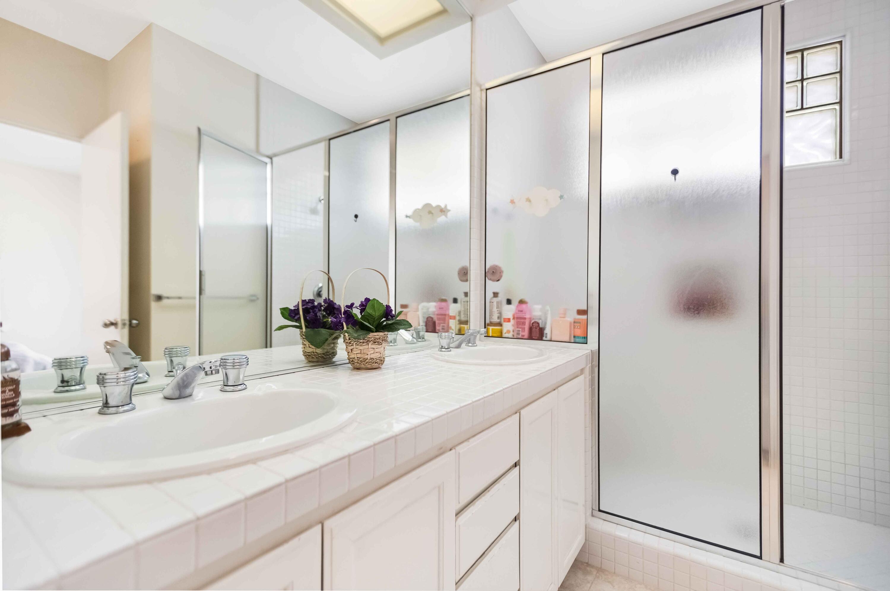 57600 Interlachen La Quinta, CA 92253 - Photo 44 of 87 a bathroom with a double vanity sink and mirror