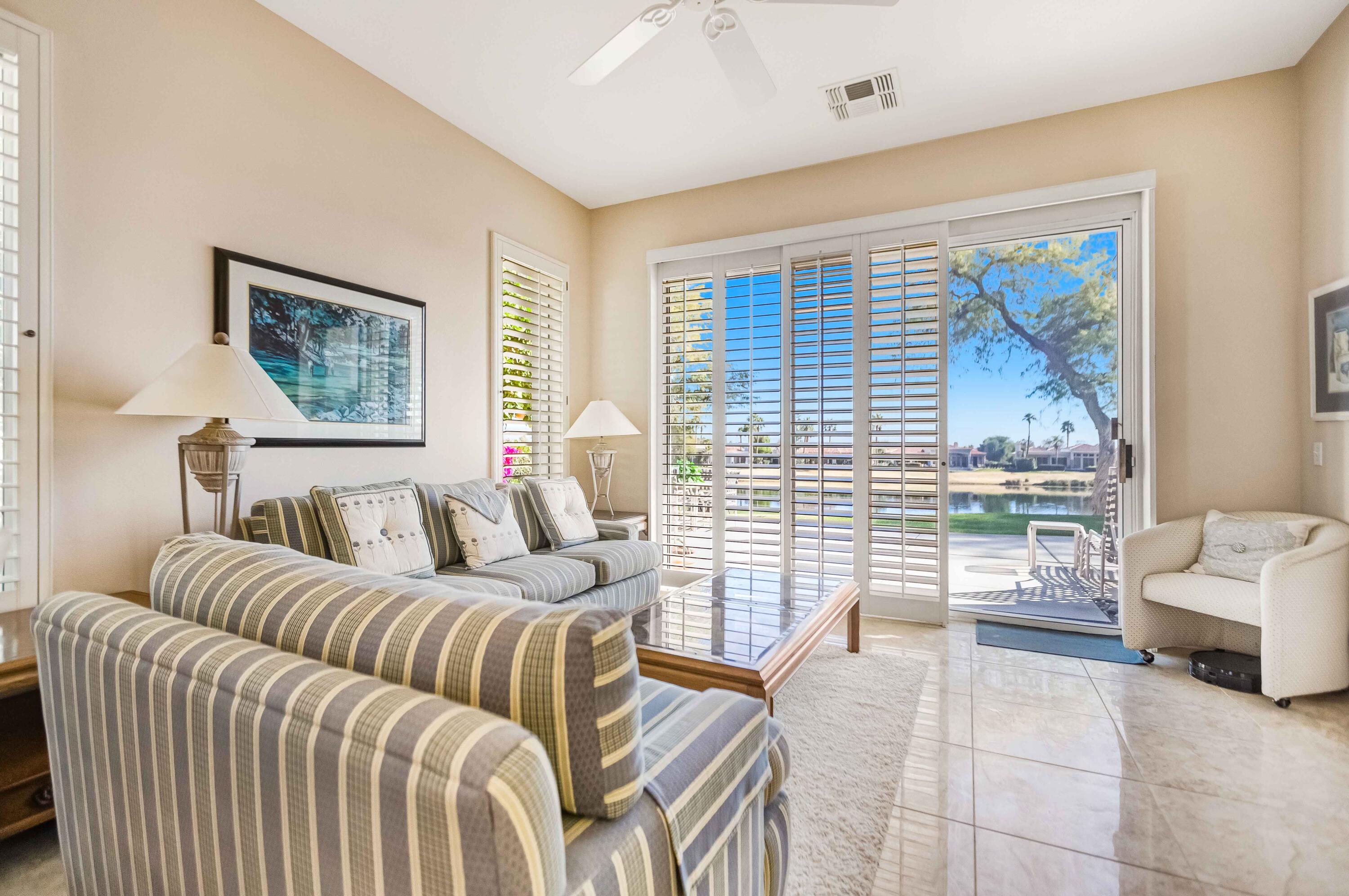 57600 Interlachen La Quinta, CA 92253 - Photo 60 of 87 a living room with furniture and a large window