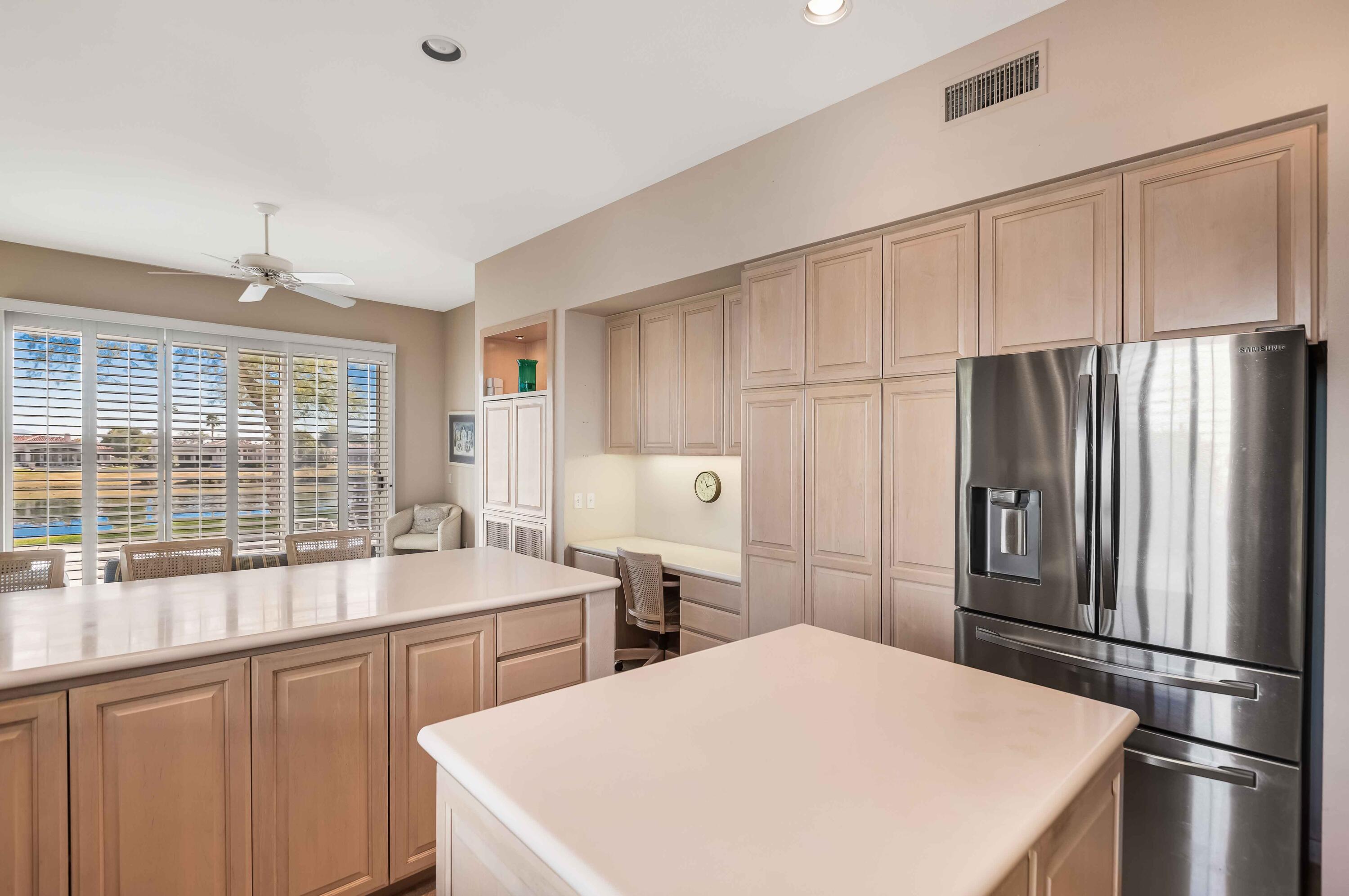 57600 Interlachen La Quinta, CA 92253 - Photo 64 of 87 a kitchen with stainless steel appliances a refrigerator sink and cabinets