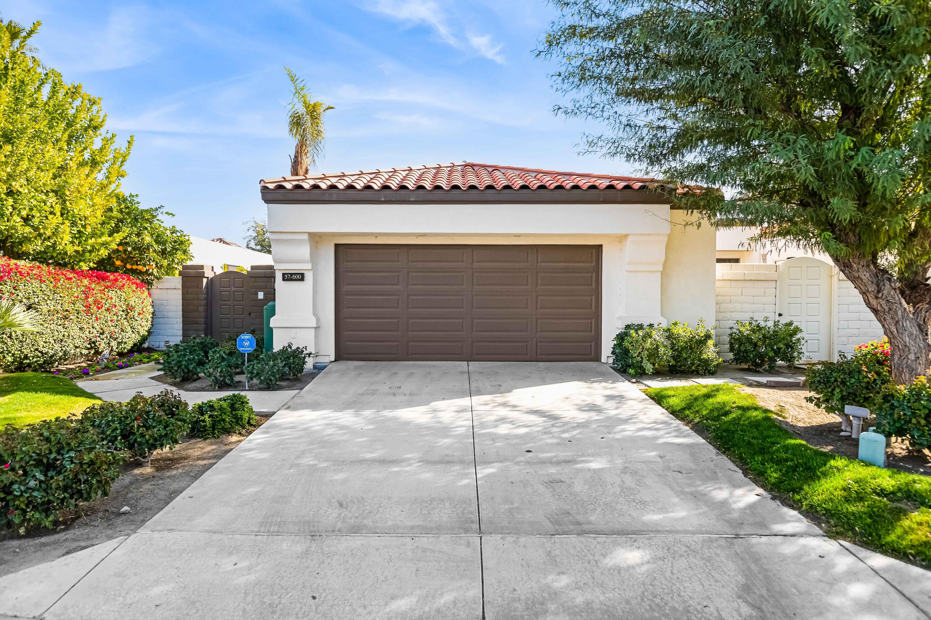 57600 Interlachen La Quinta, CA 92253 - Photo 65 of 87 a front view of a house with a garage
