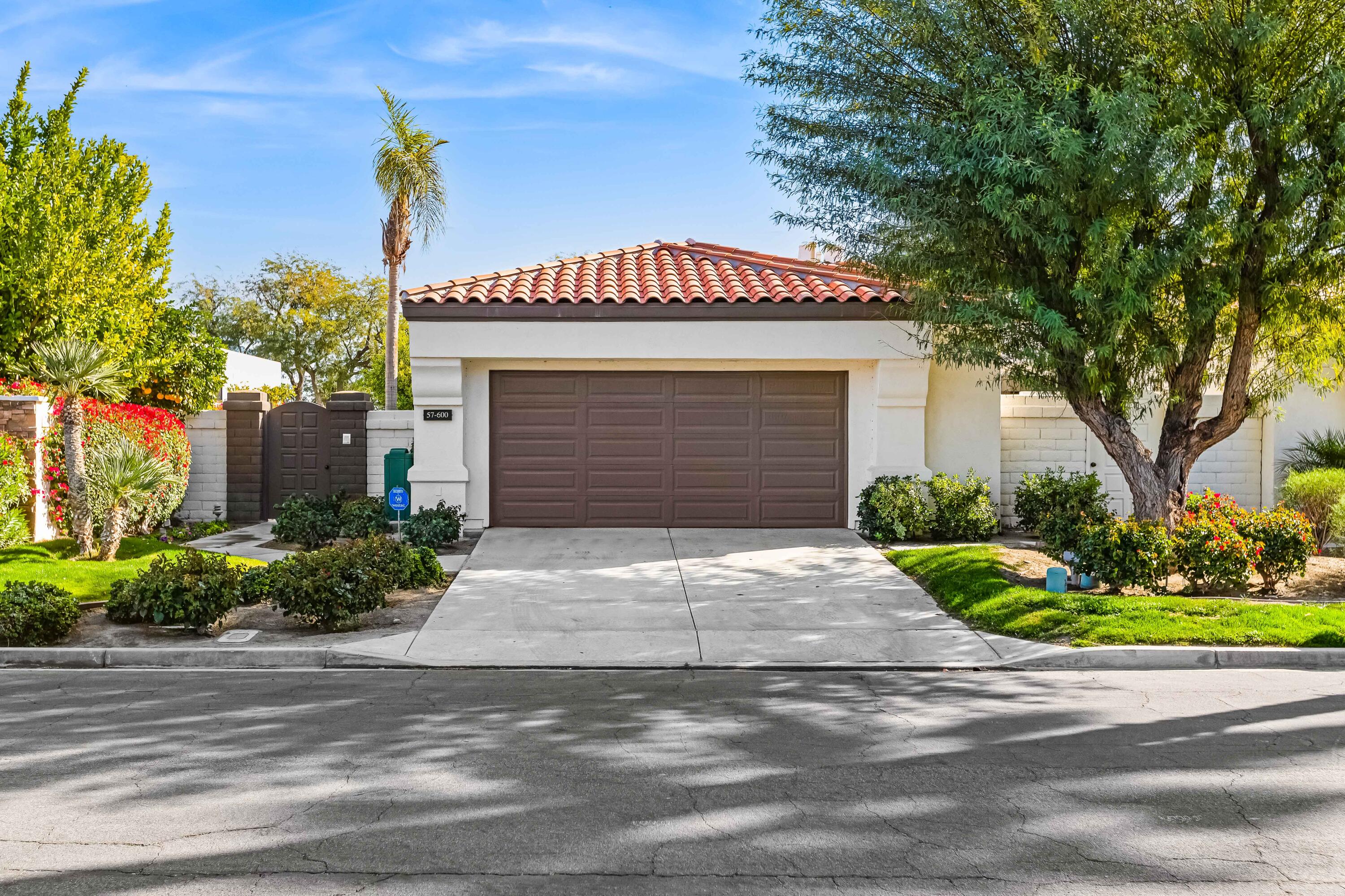57600 Interlachen La Quinta, CA 92253 - Photo 67 of 87 a front view of a house with a yard and garage