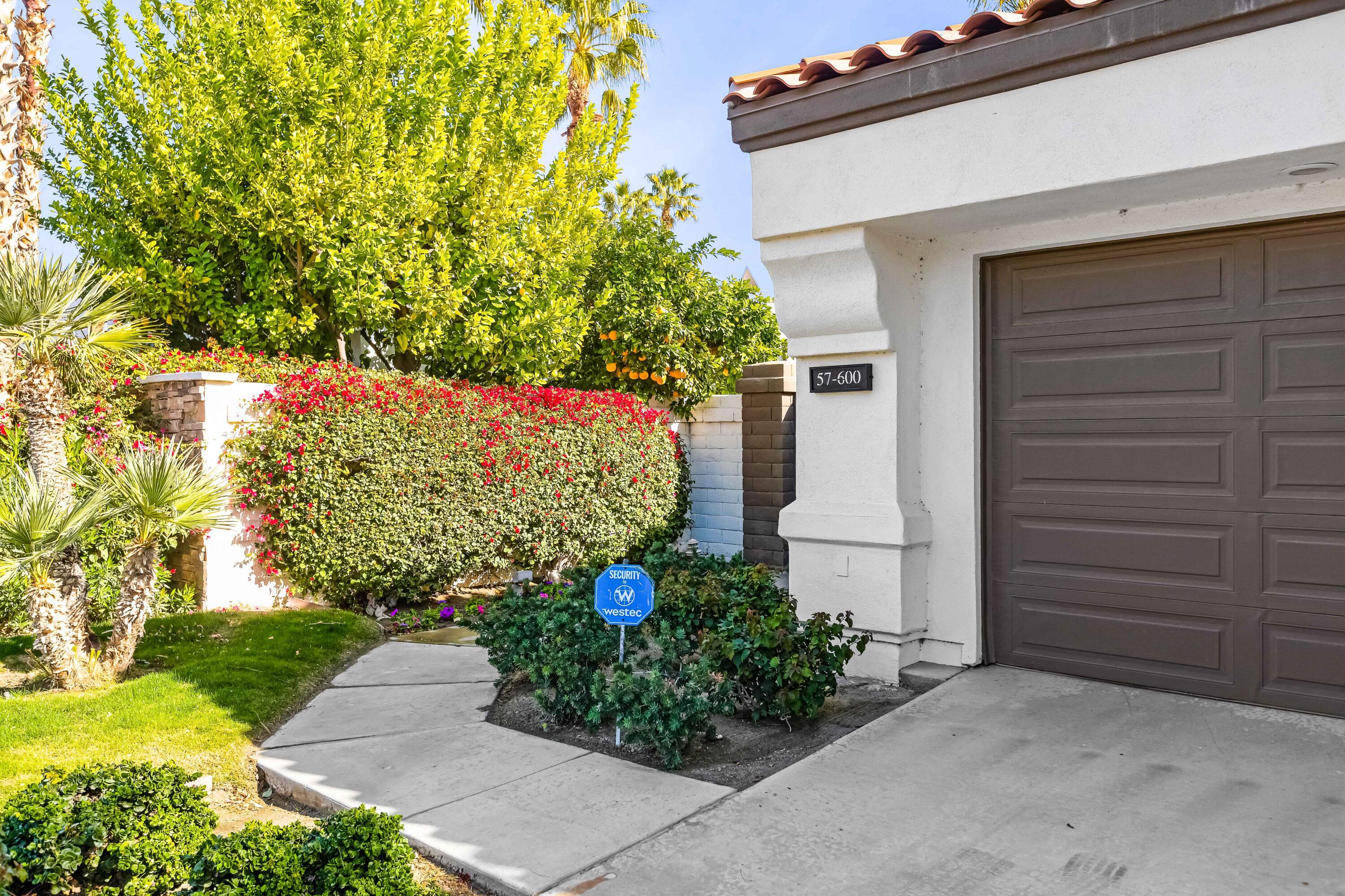 57600 Interlachen La Quinta, CA 92253 - Photo 69 of 87 a front view of a house with a yard
