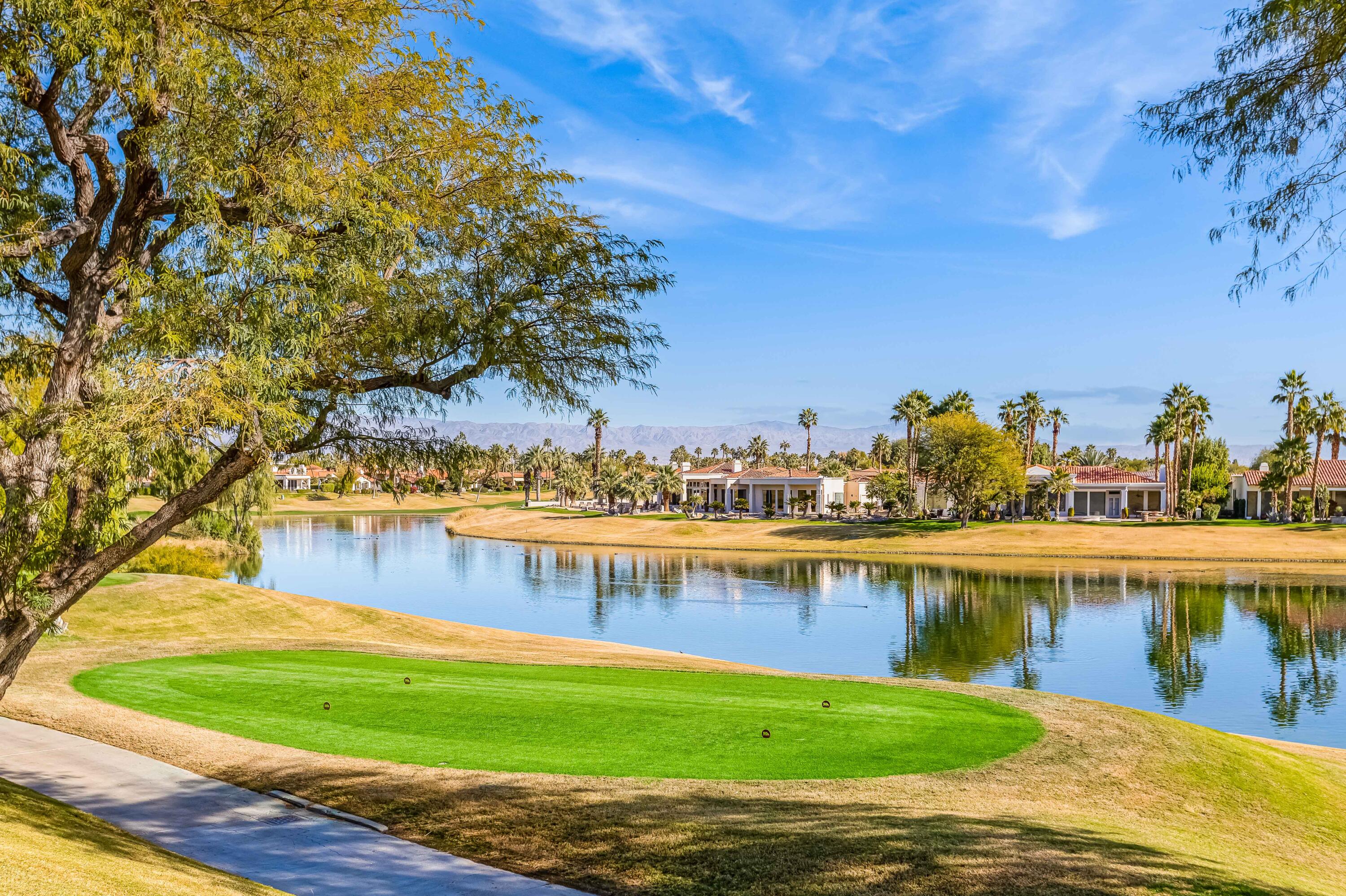 57600 Interlachen La Quinta, CA 92253 - Photo 83 of 87 a view of a lake with a house in the background