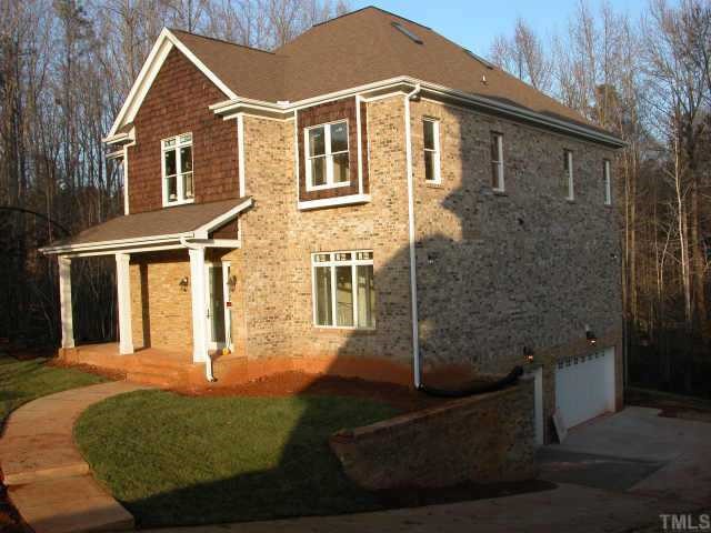 22 Wheatstone Lane Raleigh, NC 27613 - Photo 1 of 1 a front view of a house with garden