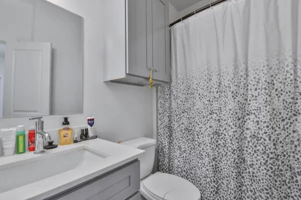 a bathroom with a toilet and sink