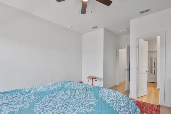 a bedroom with a bed and a view of bathroom