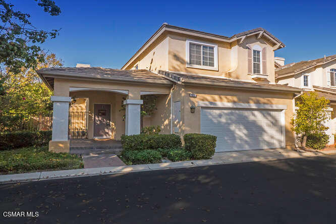 273 Springmist Lane Simi Valley, CA 93065 - Photo 1 of 14 a front view of a house with a yard and garage