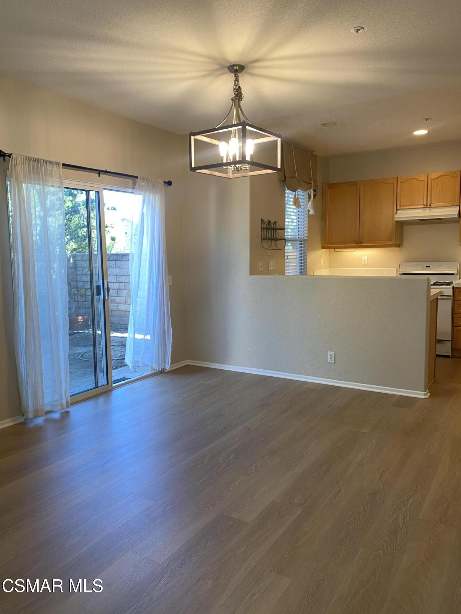 273 Springmist Lane Simi Valley, CA 93065 - Photo 6 of 14 an empty room with wooden floor and windows