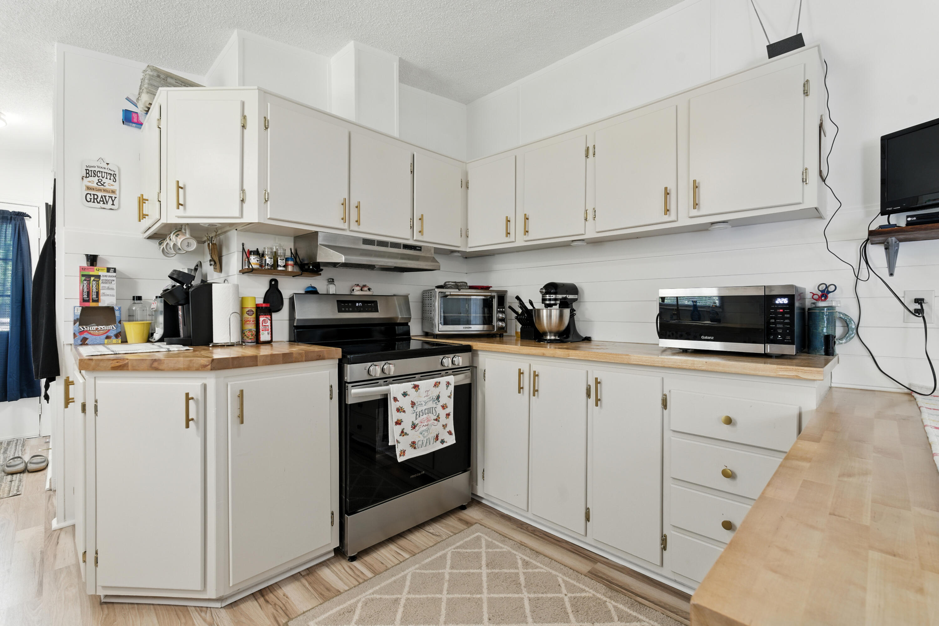 221 Cedar Court Gretna, VA 24557 - Photo 15 of 39 a kitchen with white cabinets and appliances