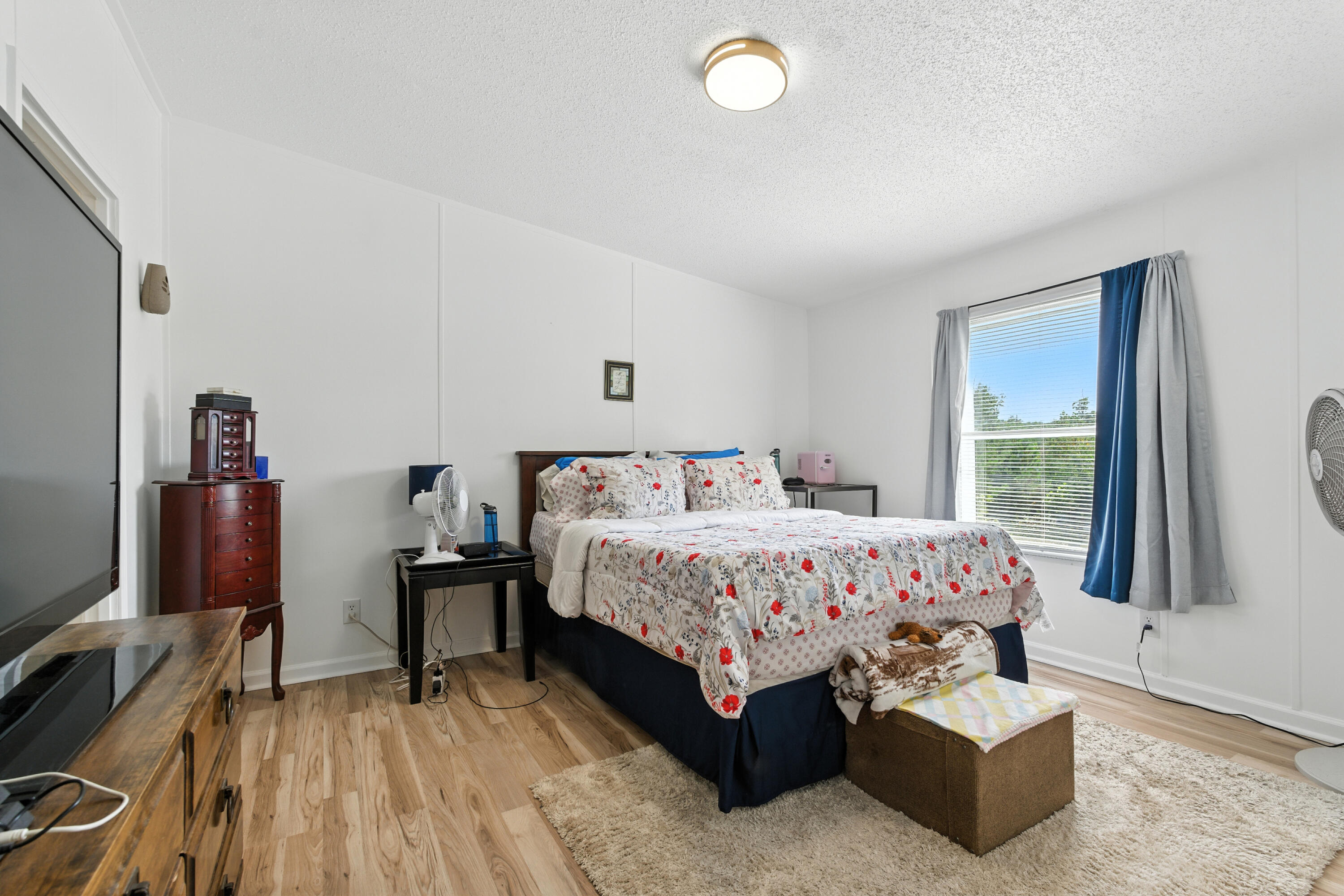 221 Cedar Court Gretna, VA 24557 - Photo 16 of 39 a bedroom with a bed and a flat tv screen