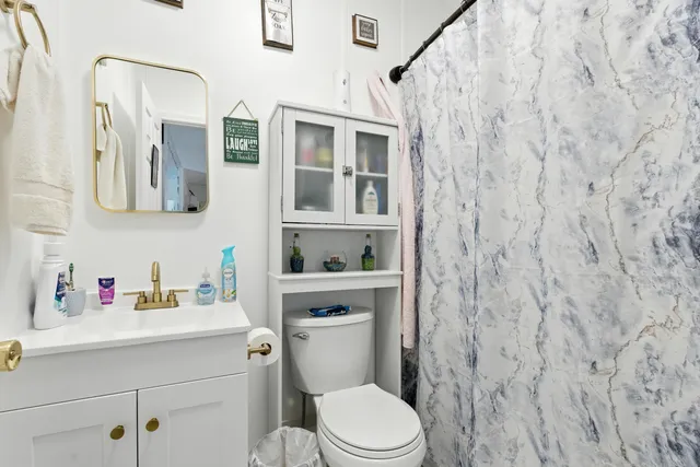 an aerial view of a house with a yard basket ball court and outdoor seating