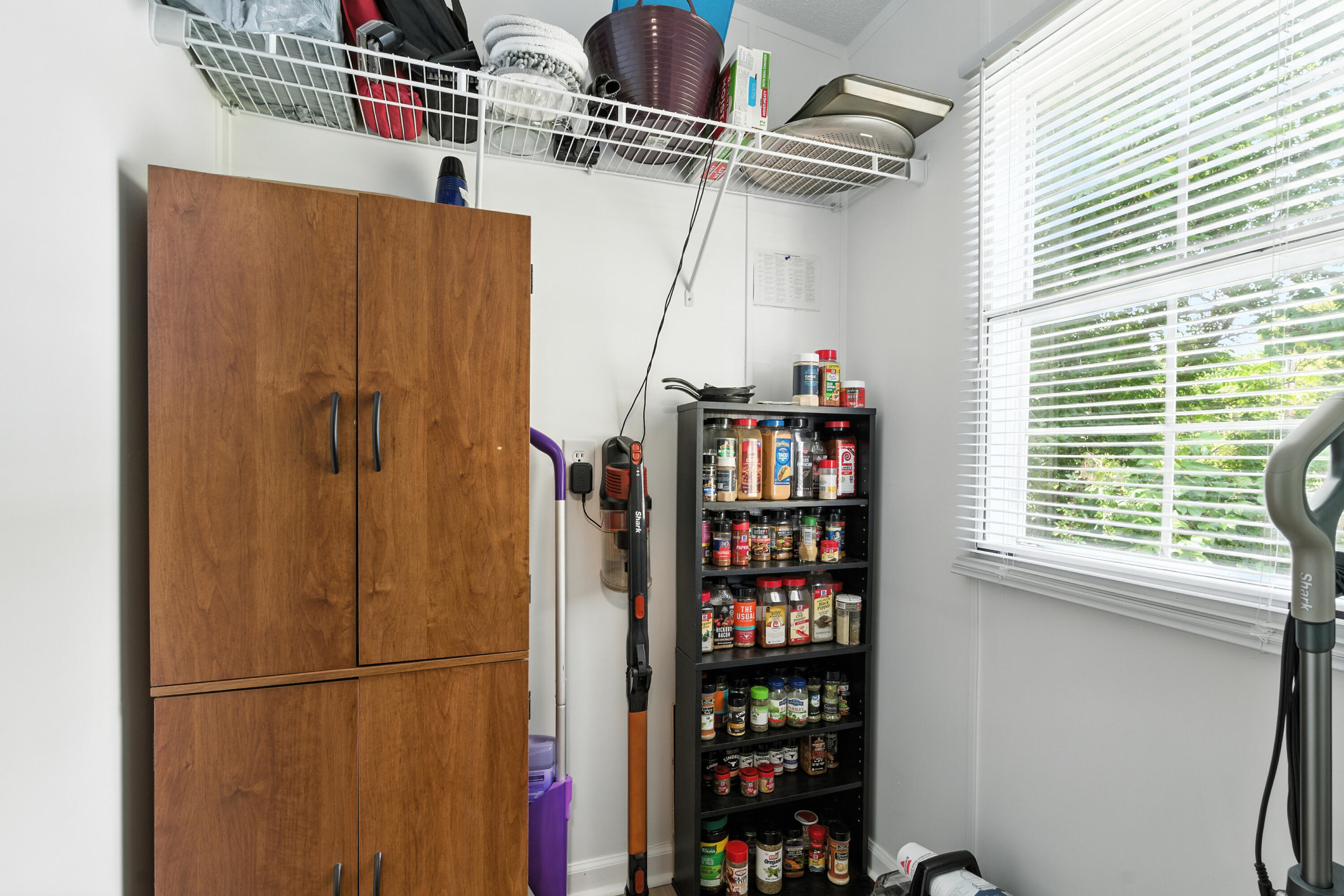 221 Cedar Court Gretna, VA 24557 - Photo 26 of 39 a view of walk in closet with clothes and shoes