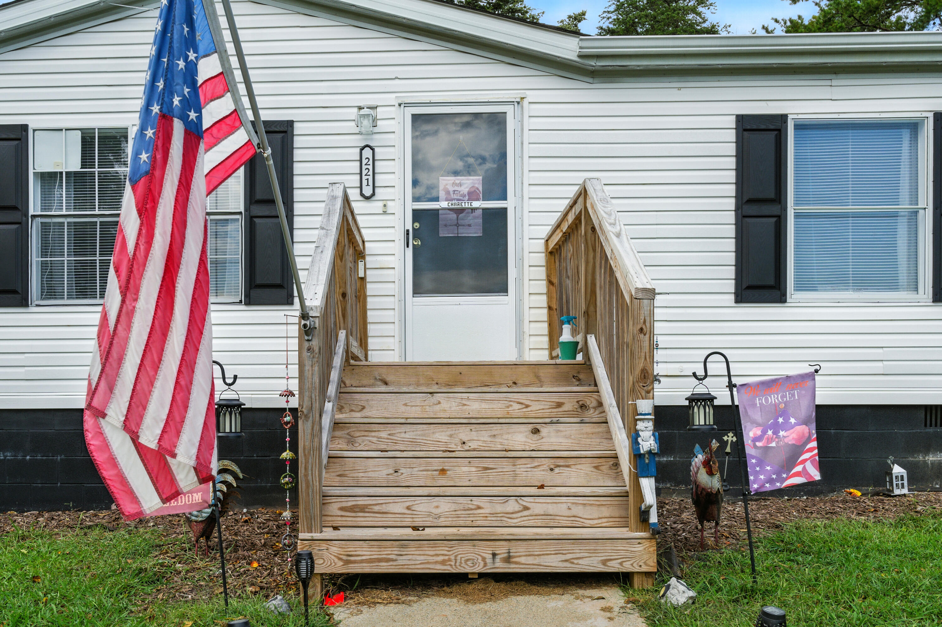 221 Cedar Court Gretna, VA 24557 - Photo 5 of 39 a front view of a house with a yard