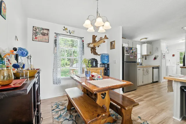 a kitchen with stainless steel appliances granite countertop a stove and cabinets