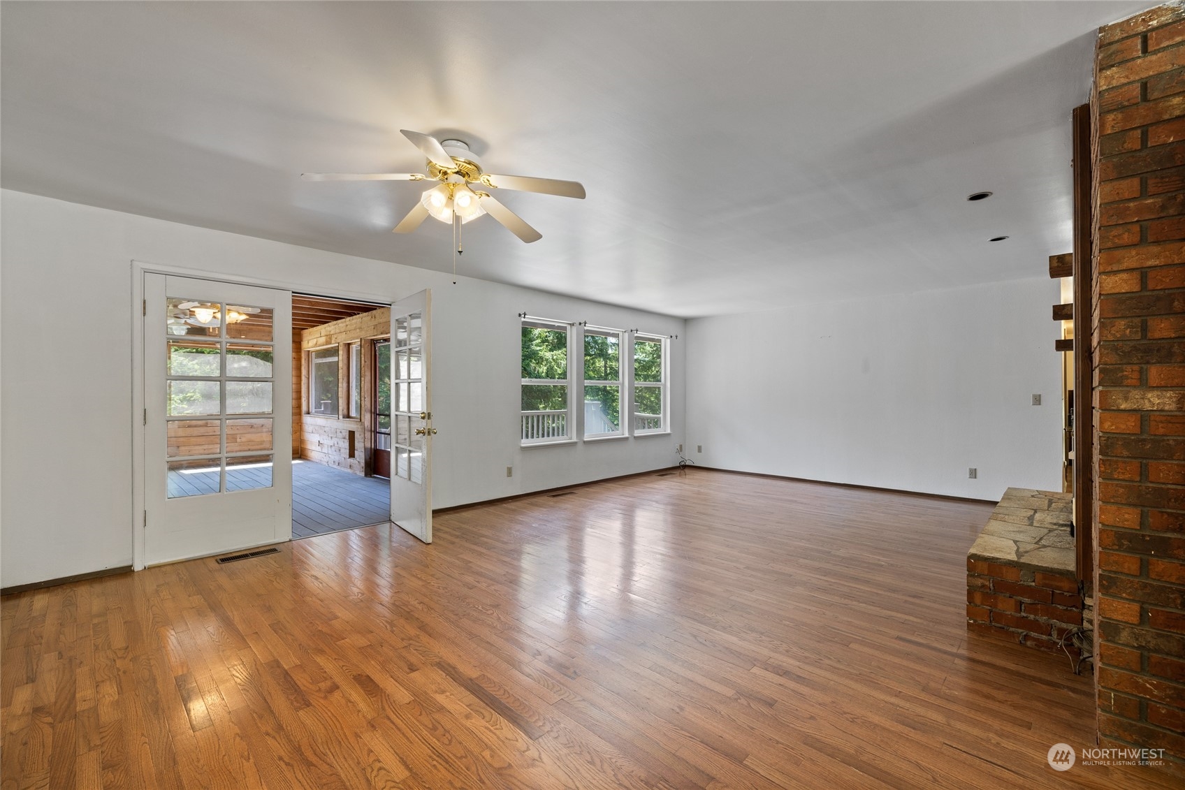 828 Lucas Creek Road Chehalis, WA 98532 - Photo 17 of 36 wooden floor in an empty room with a window