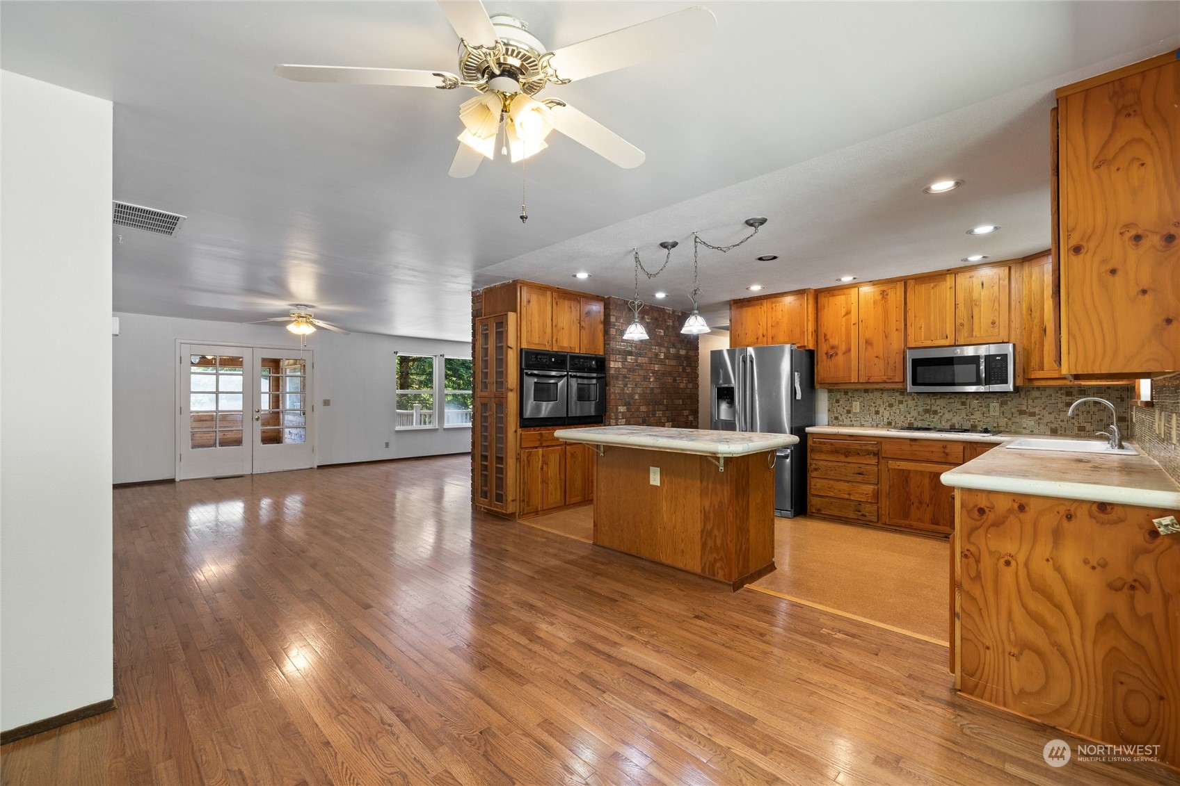 828 Lucas Creek Road Chehalis, WA 98532 - Photo 20 of 36 a view of a kitchen with kitchen island a sink stainless steel appliances and cabinets