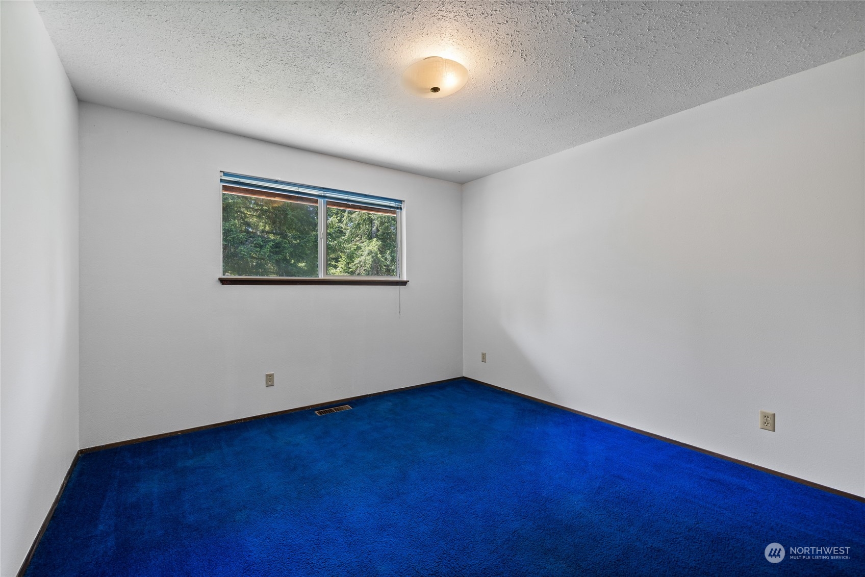 828 Lucas Creek Road Chehalis, WA 98532 - Photo 26 of 36 an empty room with wooden floor and windows