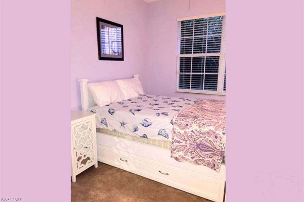 8365 Whisper Trace Way, Unit L203 Naples, FL 34114 - Photo 18 of 24 a bed room with a bed and a window