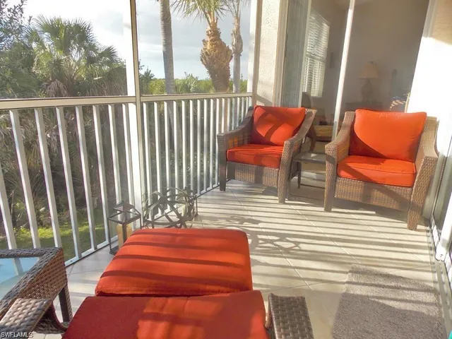 a backyard of a house with barbeque oven table and chairs