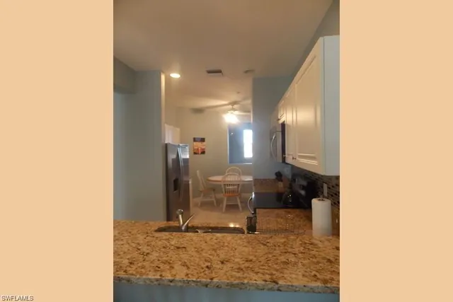 a view of a hallway with seating area