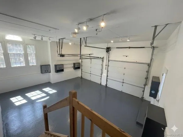 a view of a livingroom with furniture and a window