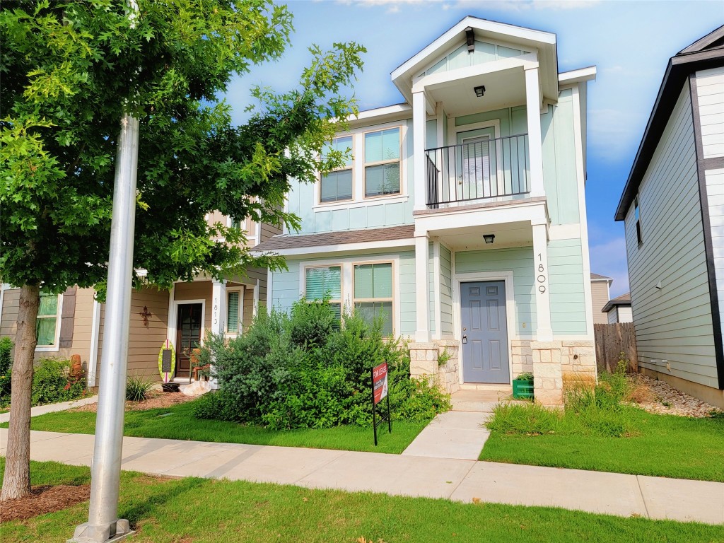 1809 Artesian Spgs Crossing Leander, TX 78641 - Photo 1 of 1 a front view of a house with a yard