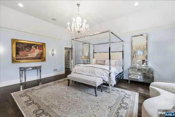 a bedroom with bed and window