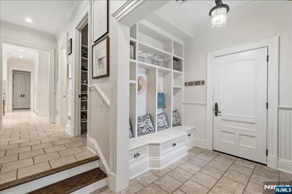 a bathroom with a double vanity sink a mirror and a shower