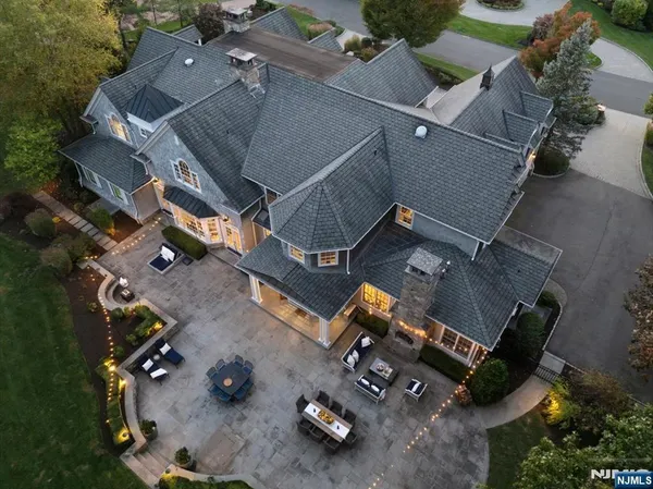 an aerial view of a house with parking space