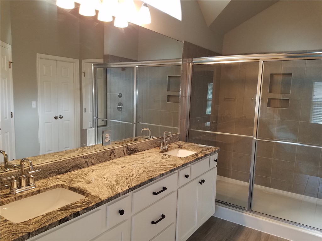 7202 Bryson Way Corpus Christi, TX 78414 - Photo 7 of 12 a bathroom with a granite countertop sink mirror and double