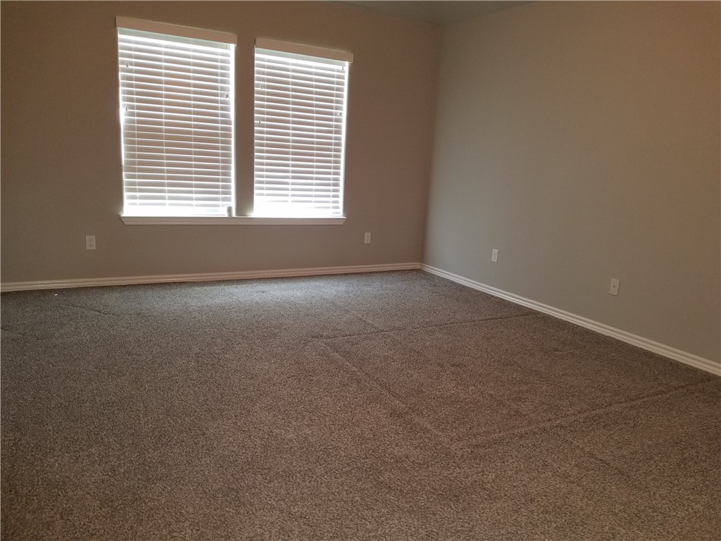 7202 Bryson Way Corpus Christi, TX 78414 - Photo 9 of 12 a view of an empty room with a window
