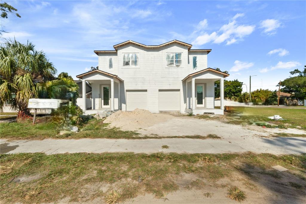 1505 West Arch Street, Unit 1 Tampa, FL 33607 - Photo 1 of 27 a front view of a house with a yard
