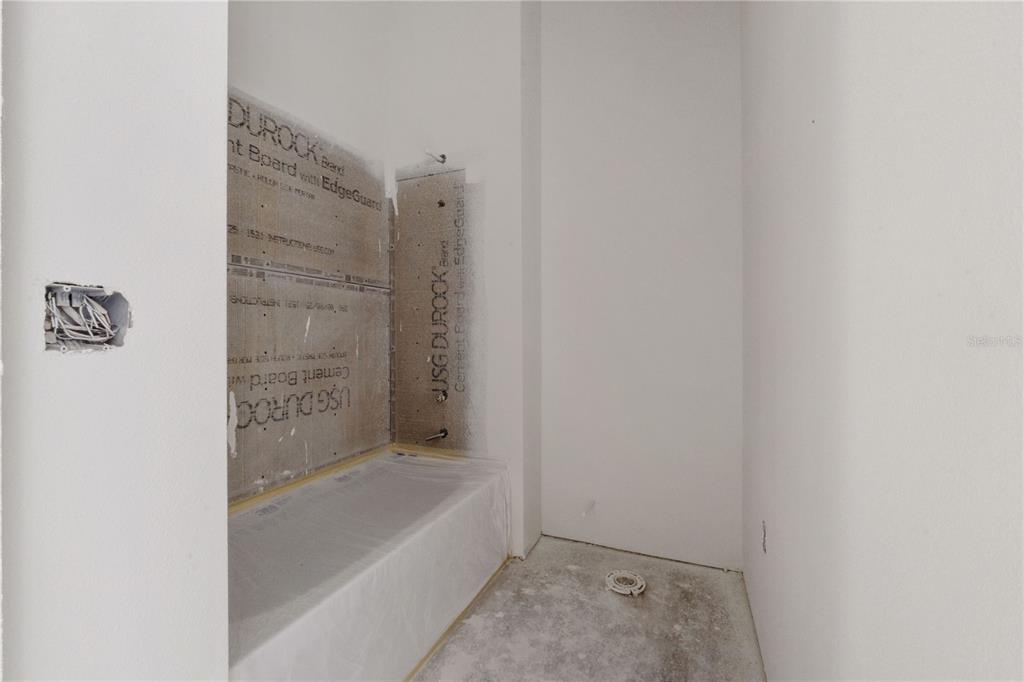 1505 West Arch Street, Unit 1 Tampa, FL 33607 - Photo 24 of 27 a bathroom with a bathtub and shower