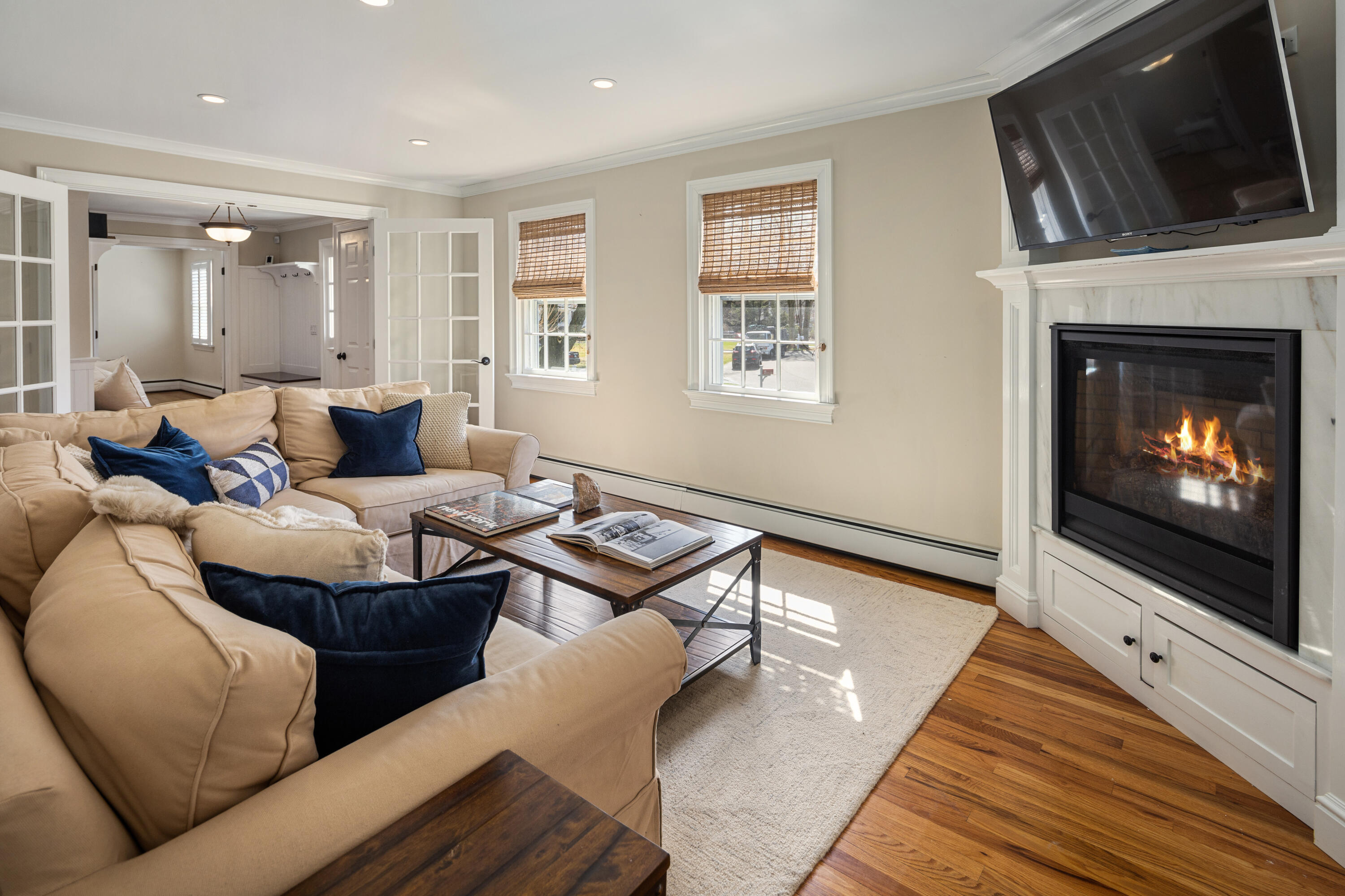 9 Duffy's Lane Darien, CT 06820 - Photo 18 of 42 a living room with furniture and a fireplace