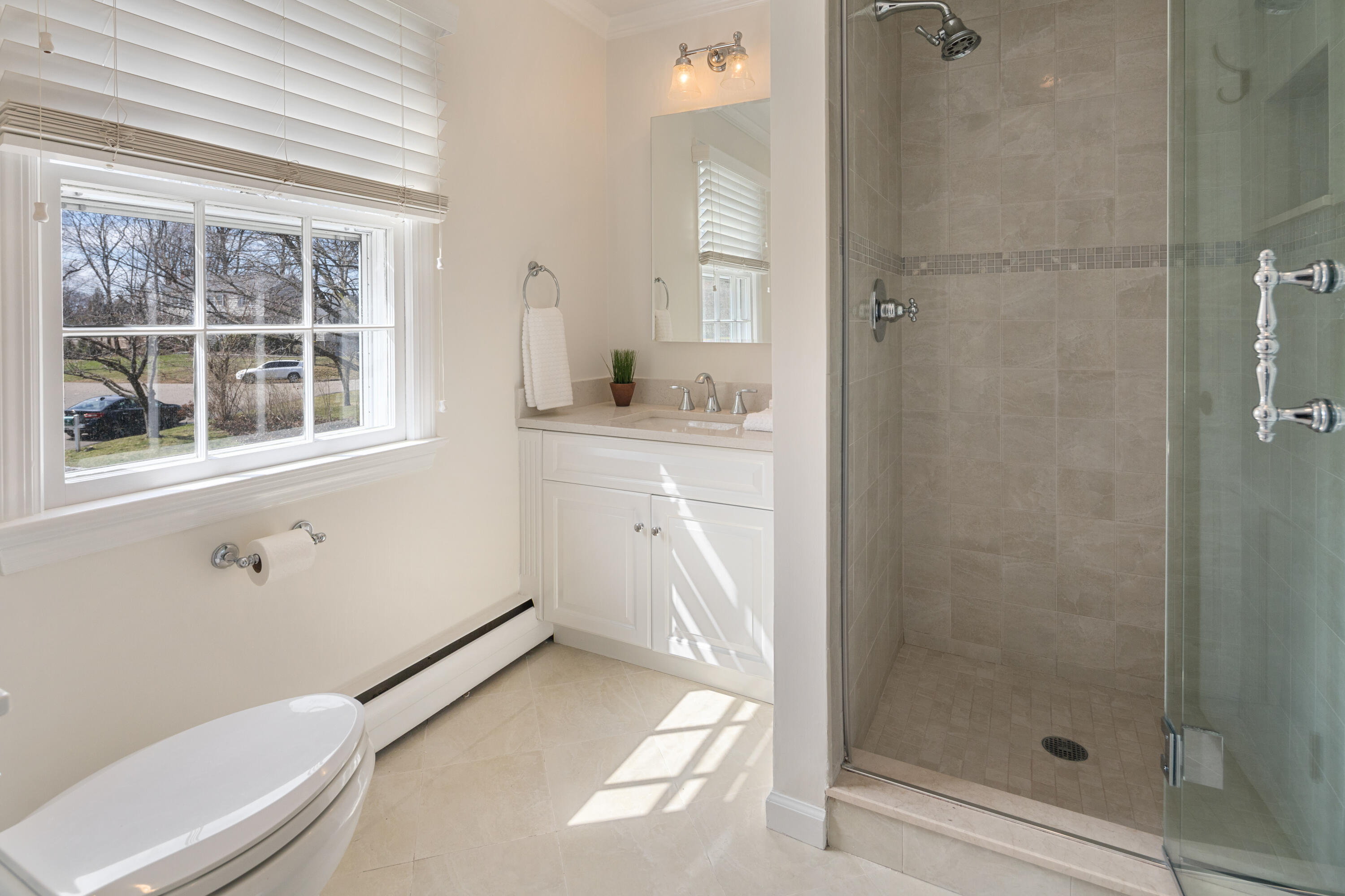 9 Duffy's Lane Darien, CT 06820 - Photo 21 of 42 a bathroom with a granite countertop sink a toilet and shower