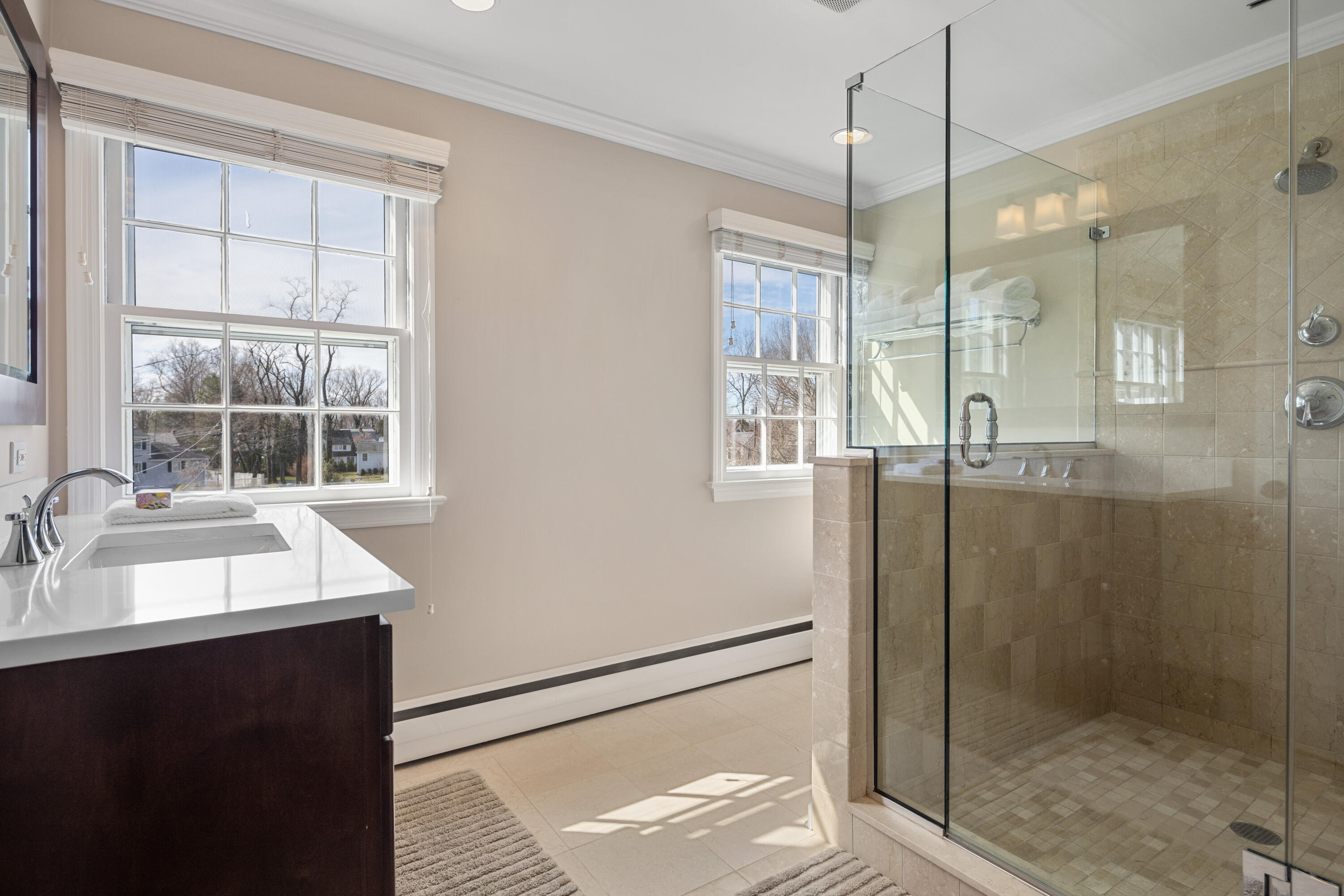9 Duffy's Lane Darien, CT 06820 - Photo 24 of 42 a bathroom with a double vanity sink window and shower