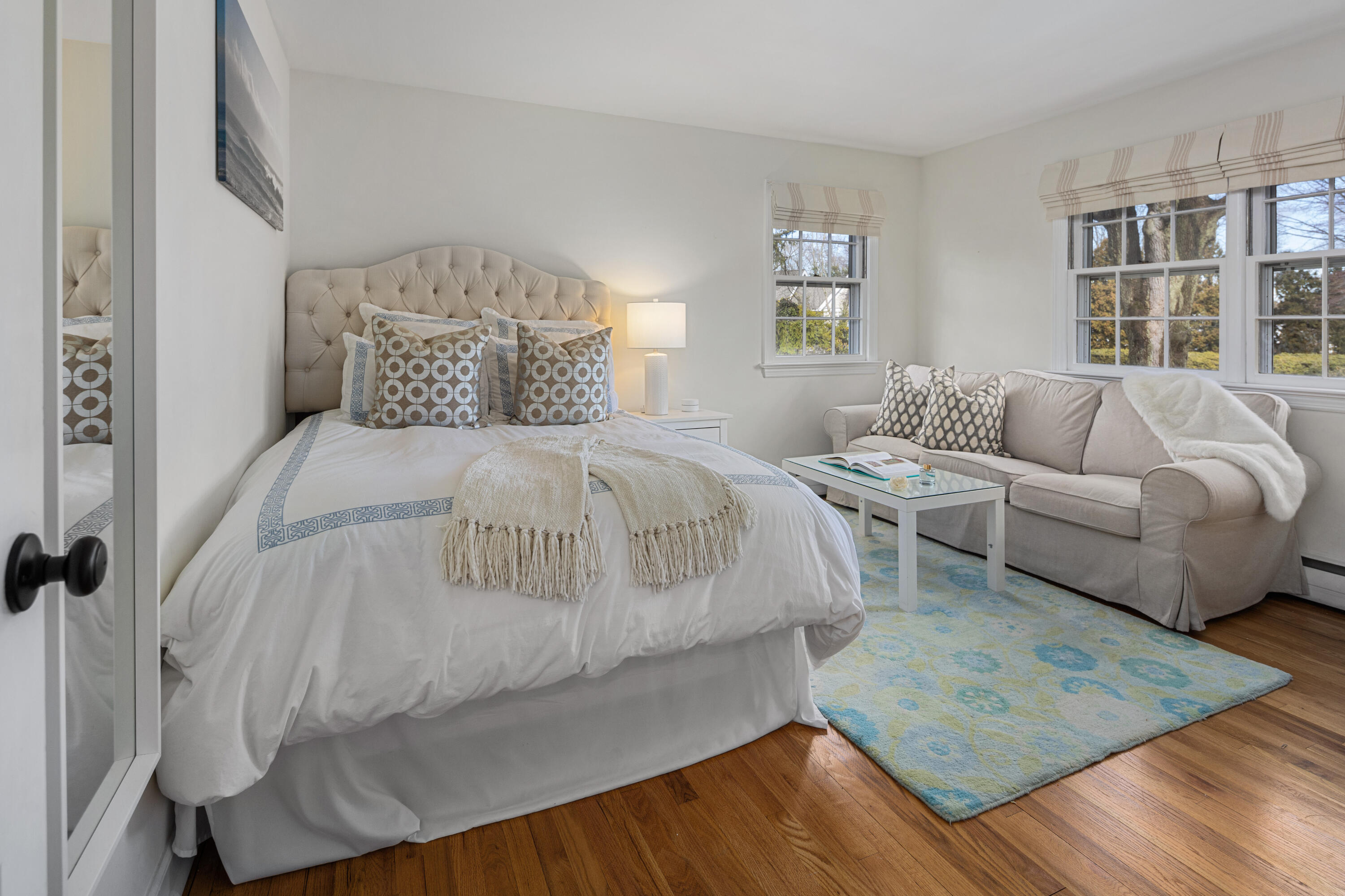 9 Duffy's Lane Darien, CT 06820 - Photo 26 of 42 a spacious bedroom with a bed a couch and a window